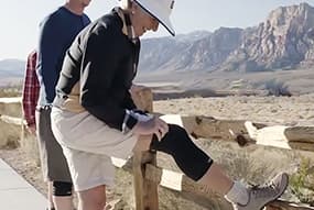 Woman hiking while wearing Copper Fit® Ice Knee Sleeves